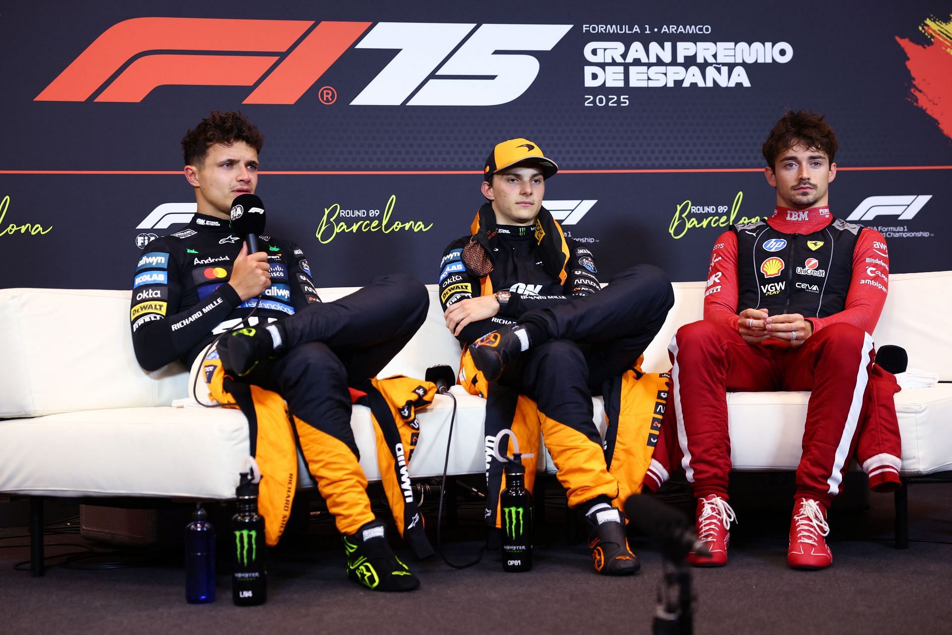 Race winner Oscar Piastri of Australia and McLaren Second placed Lando Norris of Great Britain and McLaren and Third placed Charles Leclerc of Monaco and Scuderia Ferrari in the Drivers Press Conference during the F1 Grand Prix of Spain - Source: Getty